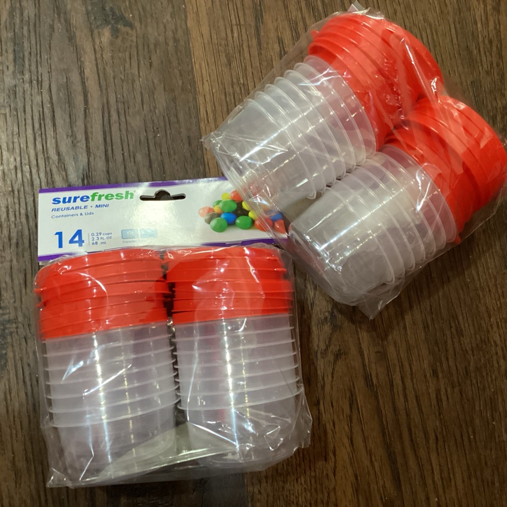 New lot of 2 Sure Fresh sets of 14 small round plastic lidded containers.